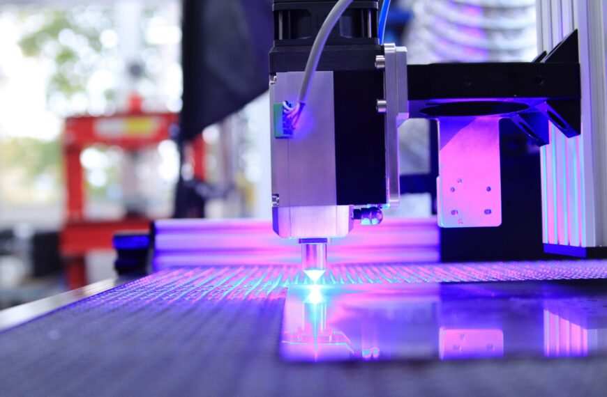 Close-up of a laser cutting machine head and optics